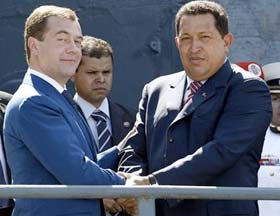 Dmitri Medvedev shakes hands with Hugo Chavez.  Source: Reuters