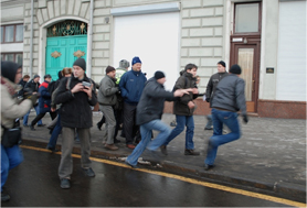 Activists running from plain-clothes police on December 12, 2009. Source: Kasparov.ru